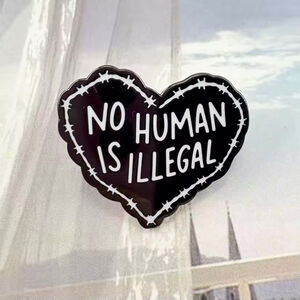 "No Human Is Illegal" Heart Enamel Pin